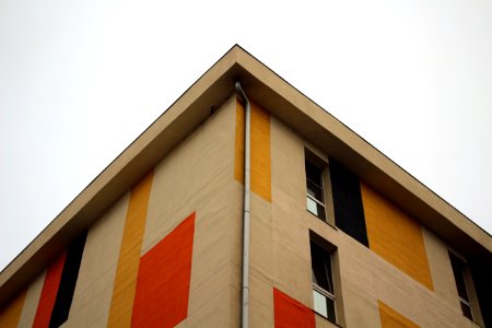 beige and red concrete building facade photo