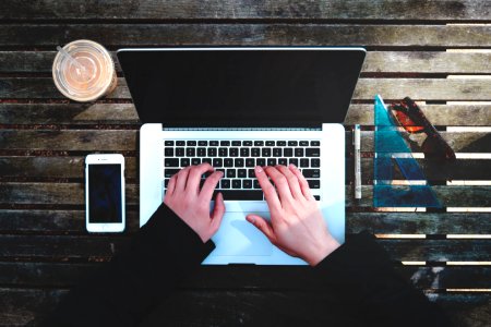 flat-lay photography of person about to use laptop computer photo