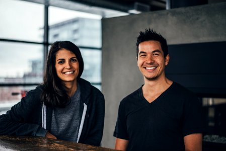 Man and woman smiling contentedly inside a loft photo