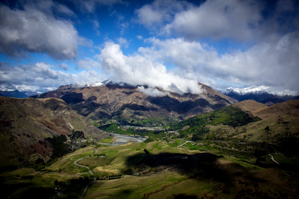 mountains under cloudy skies at daytime