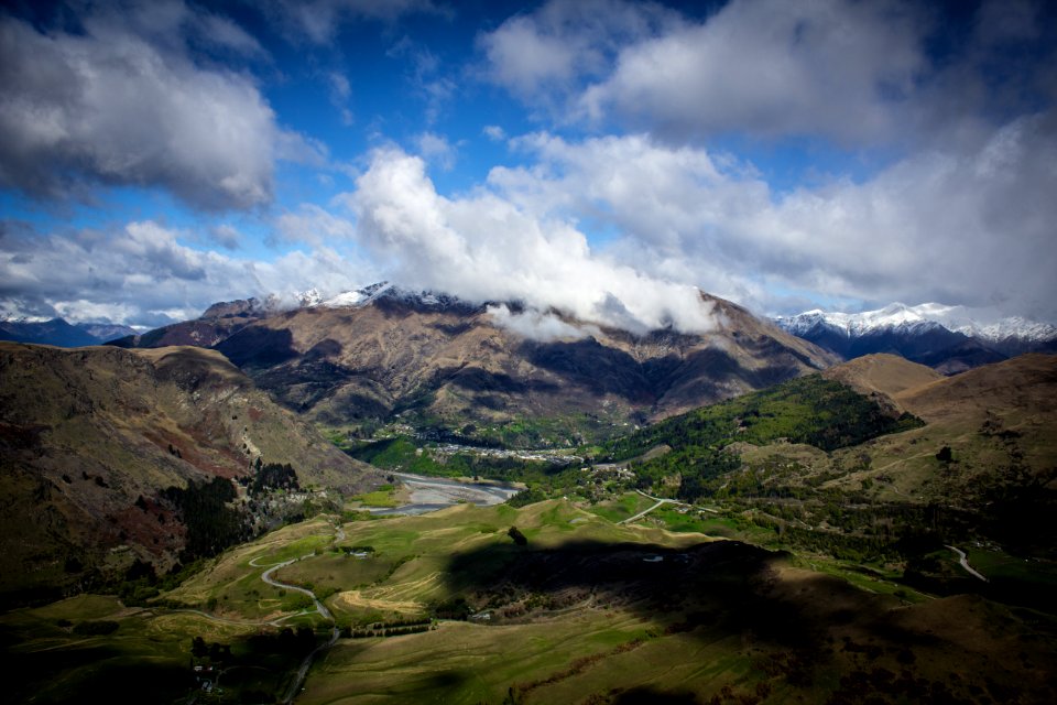 mountains under cloudy skies at daytime photo