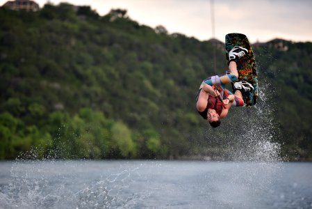 person on wakeboard flipping photo