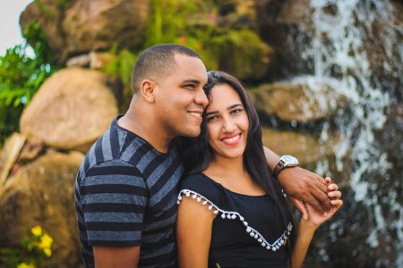 man and woman taking picture while holding their hands photo