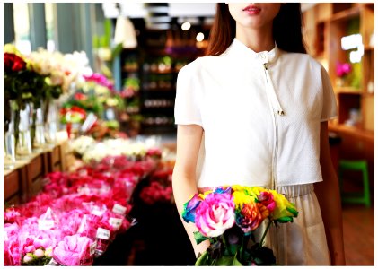 woman holding flower bouquet