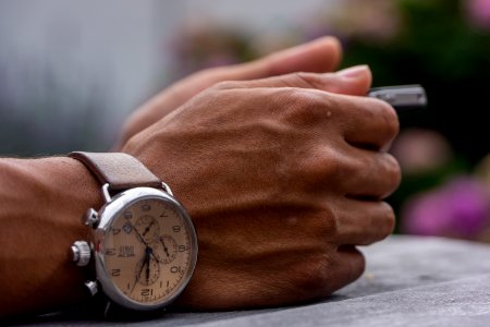 person wearing chronograph watch photo