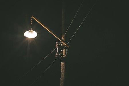 black utility pole lights turned-on photo