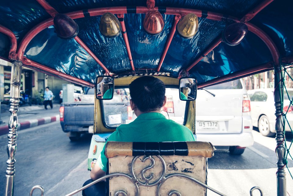 man driving rickshaw