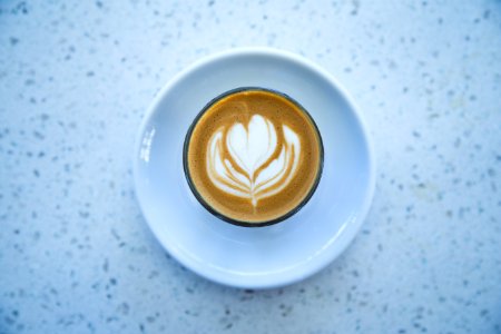 espresso coffee with heart cream formation photo