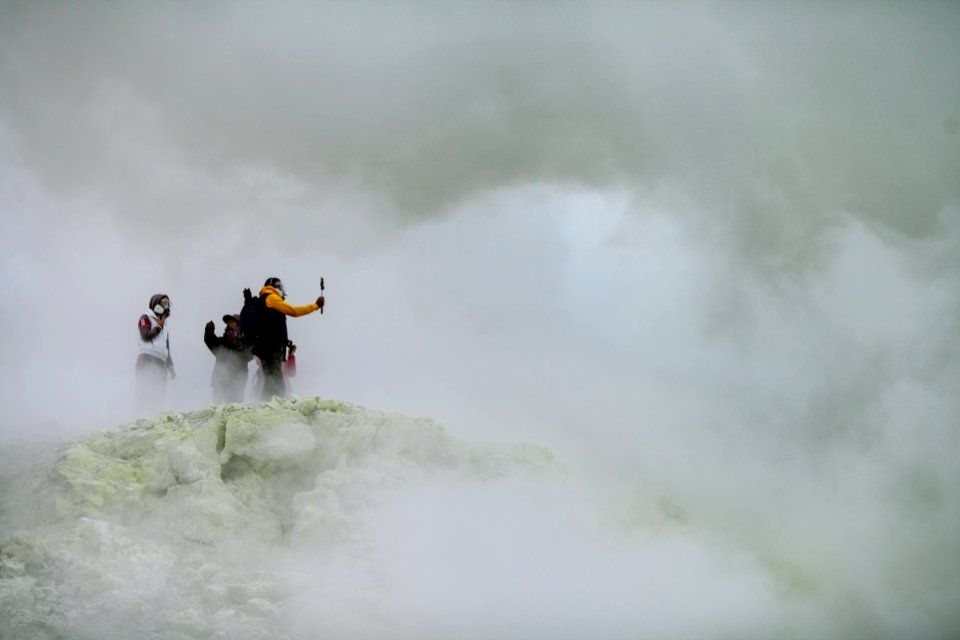 three people on mountain