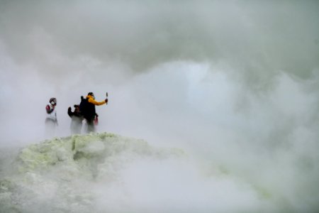 three people on mountain