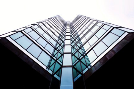 low-angle photography of curtain wall building photo