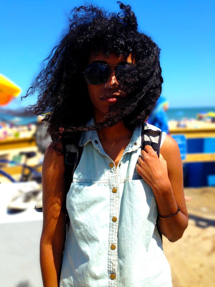 selective focus photography of person standing on seashore