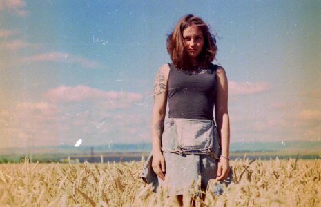 woman standing on brown field photo