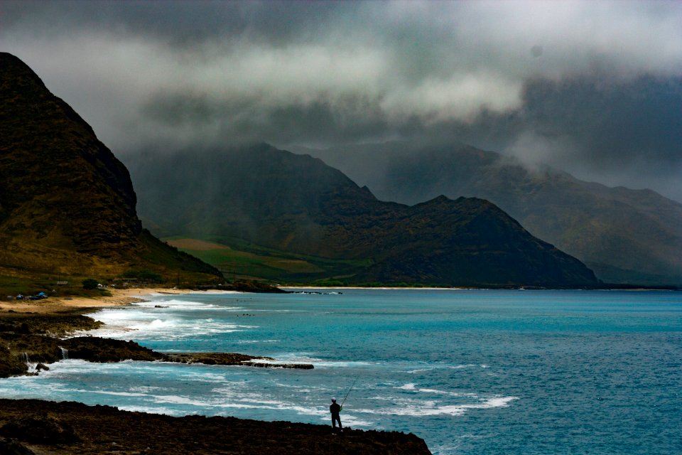 landscape photography of mountains near body of water photo