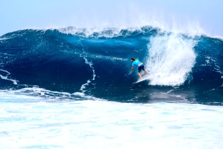 surfer surfing on tidal wave photo