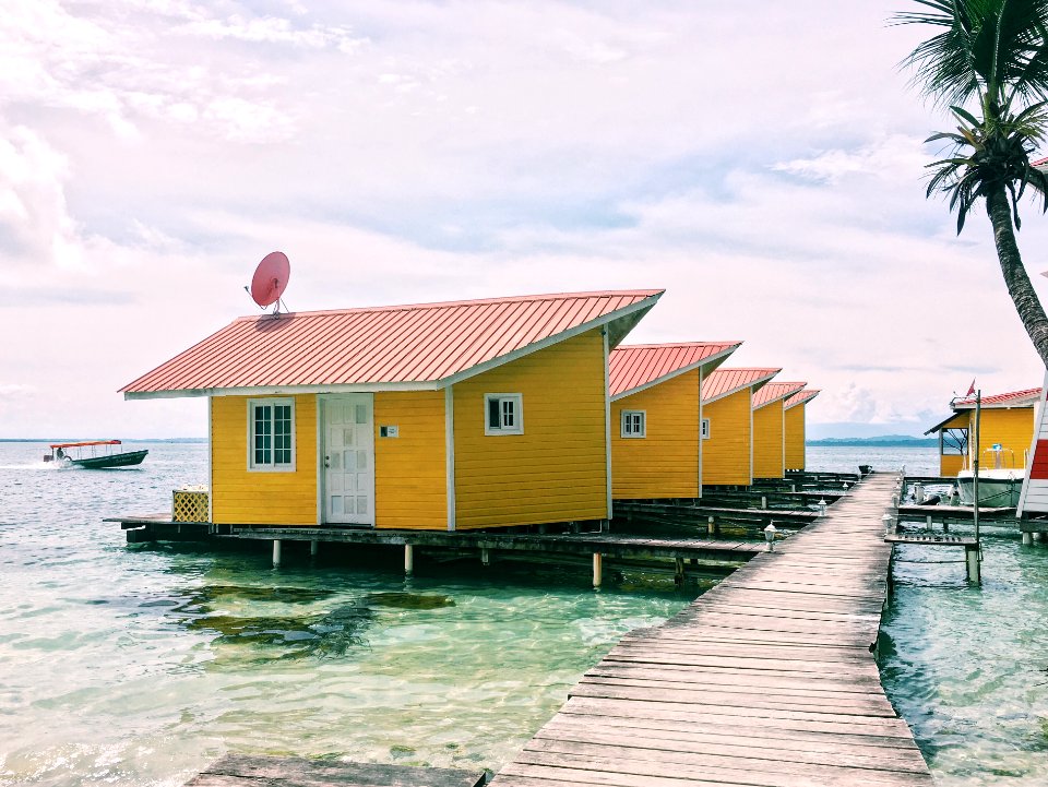 photo of brown houses on body of water