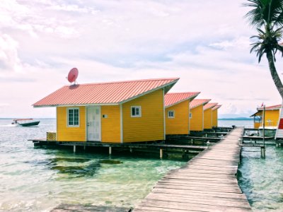 photo of brown houses on body of water