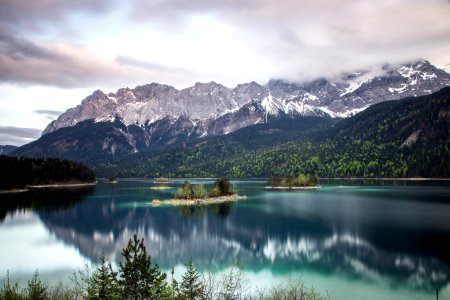 photo of grey mountain across blue lake photo