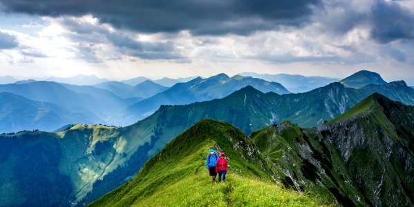 people walking on top of mountain