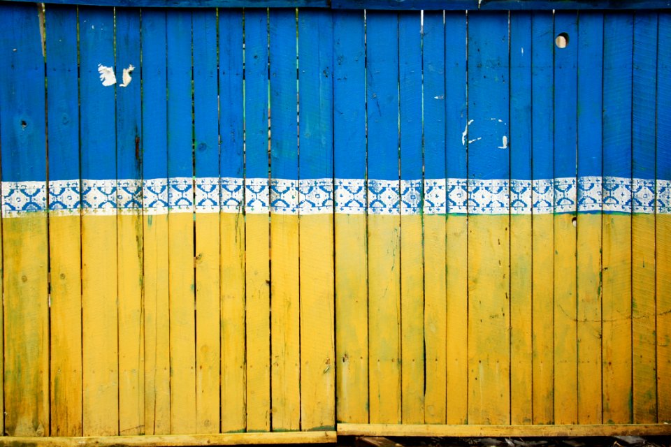 yellow and blue wooden fence