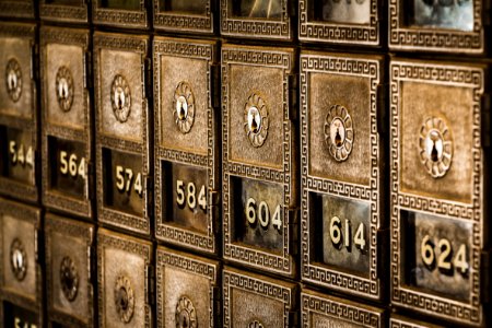 Numbers on metal deposit boxes in a bank photo