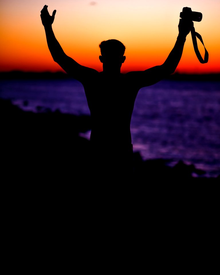 person holding DSLR camera