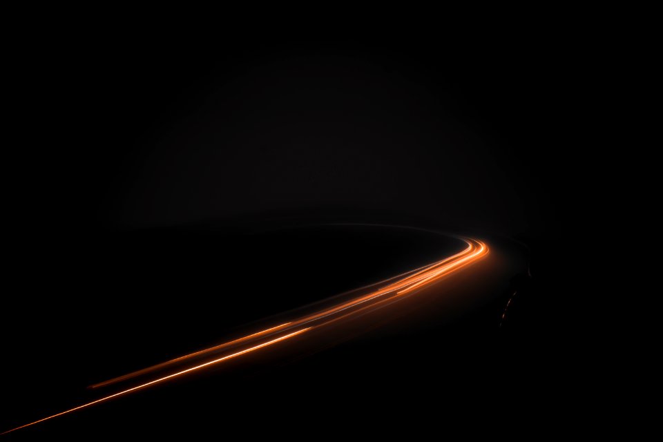 timelapse photography of vehicle on road