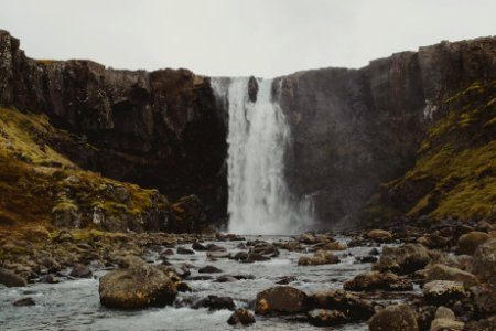 waterfalls near rocks photo