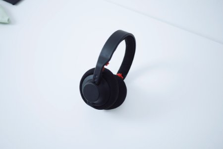 black wireless headphones on white table photo