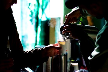 man holding thermos