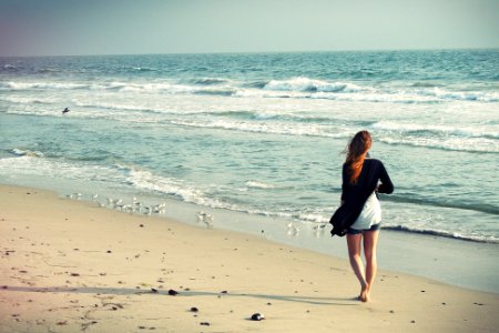 woman standing at seashore photo