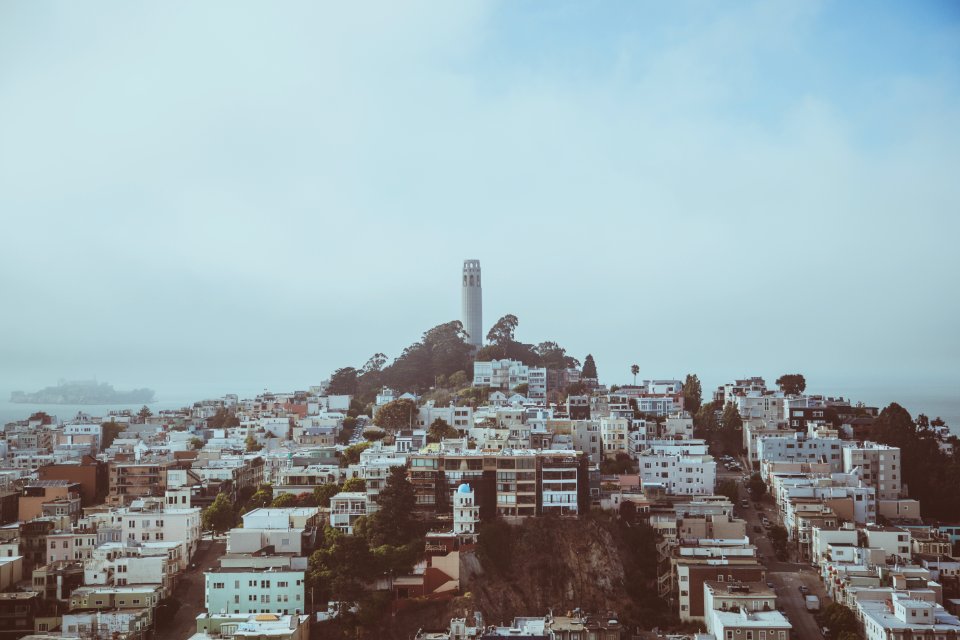 lighthouse between houses photo