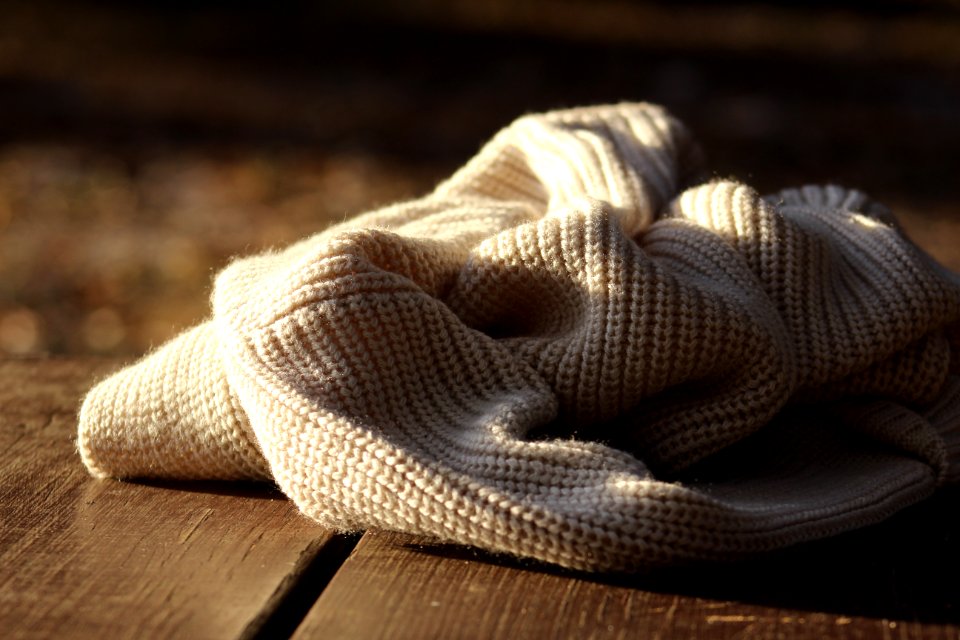 white textile on wooden plank photo