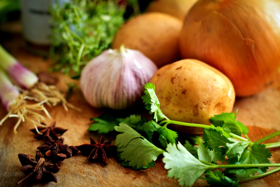 onions and potato on table