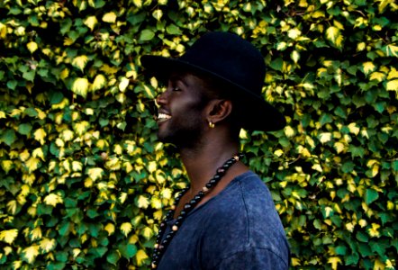 man standing beside living wall photo