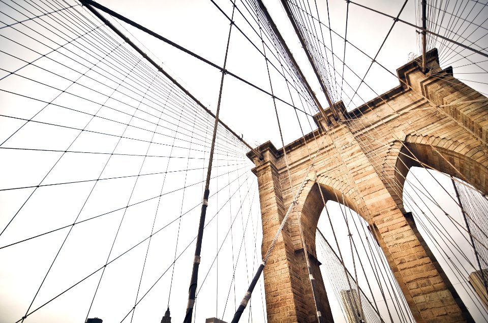 cable bridge under white sky