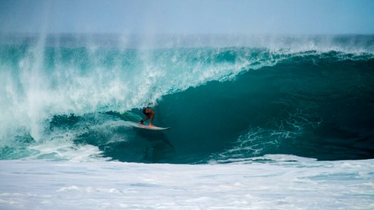 person surfing on a water wave photo