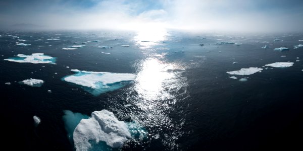 landscape and aerial photography of icebergs on body of water during daytime photo