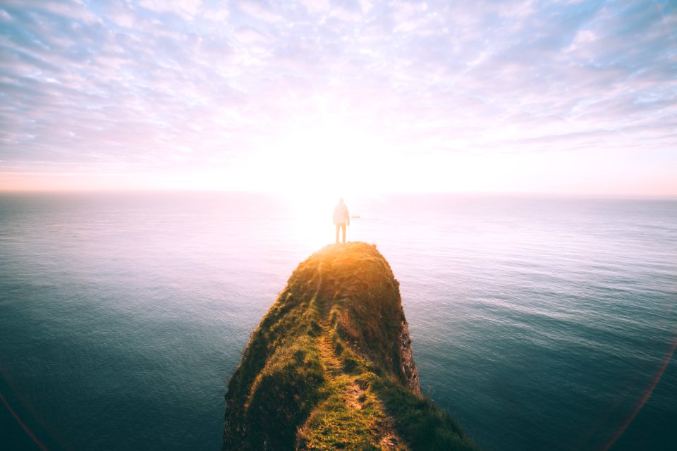 person on top of the cliff