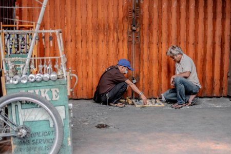 two men playing chess photo