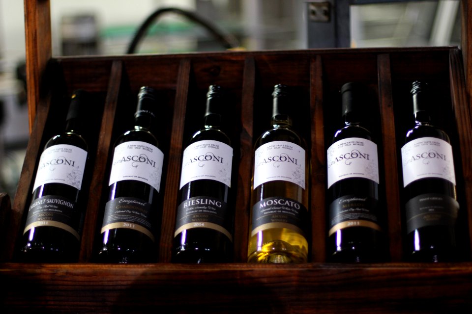 several labeled bottles on rack