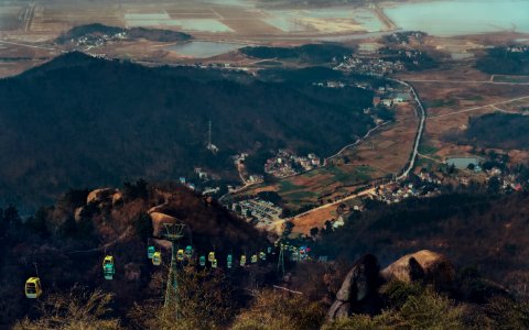 cable cars on mountain during daytime photo