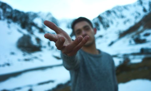 person on snow covered mountain during daytime photo