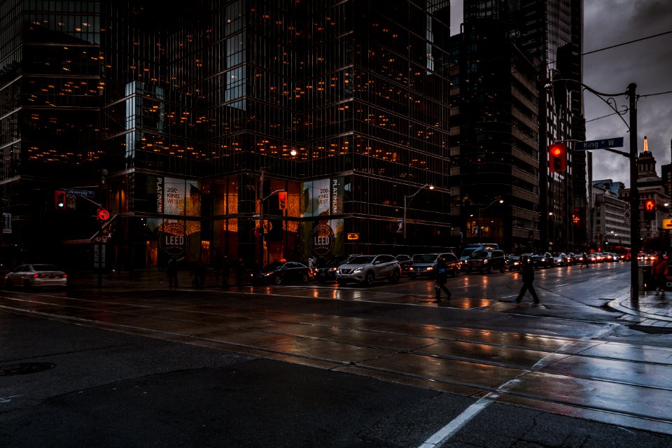 city road near buildings during midnight