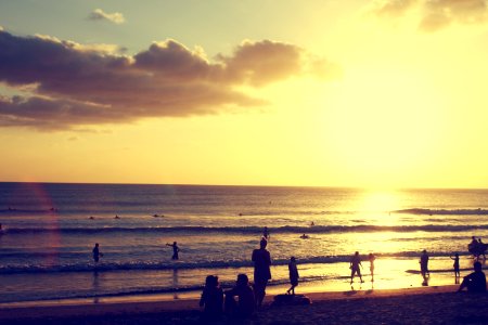 silhouette photography of people standing on shore near sea