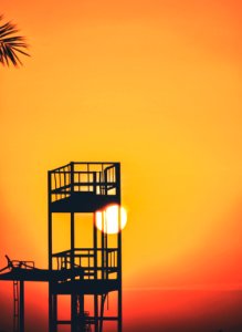 silhouette of watch tower during golden hour photo