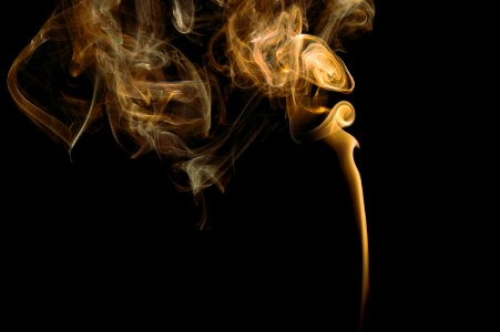 yellow smoke in black background
