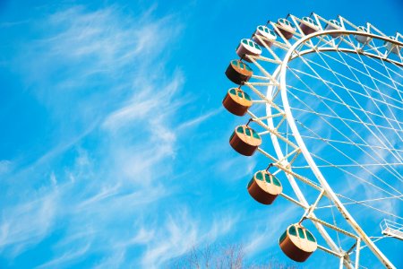 white Ferris wheel under clear sky during daytime photo