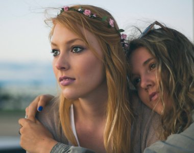 two women close up photography photo