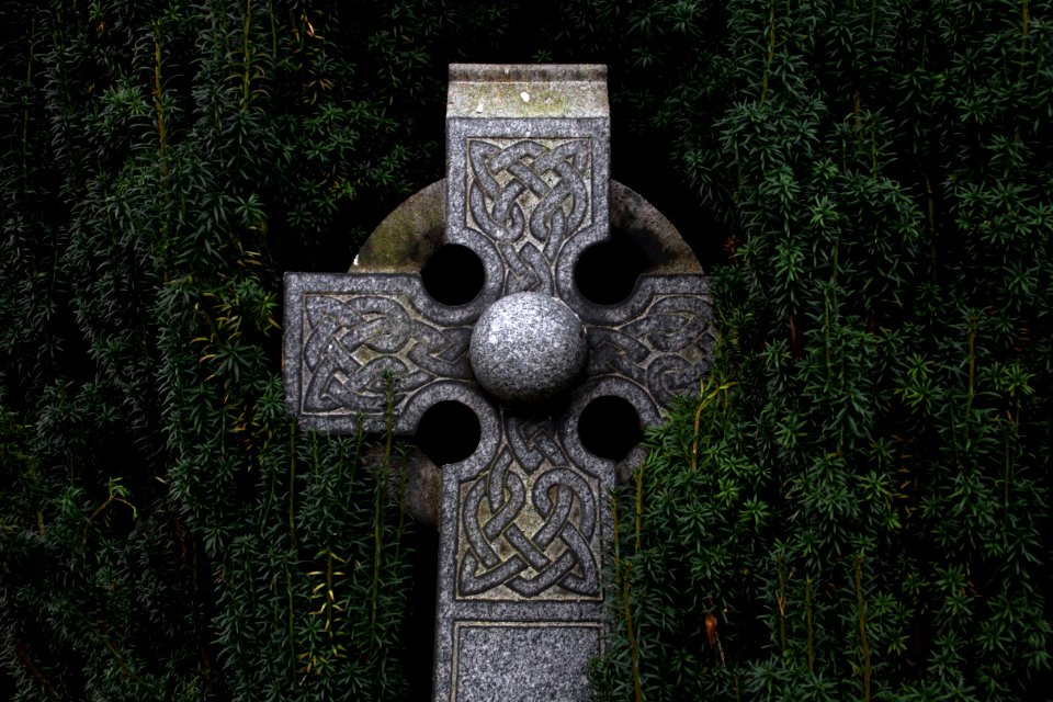 gray concrete cross statue